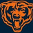 Pixelated orange and dark blue icon depicting a stylized bear head with closed eyes, mouth open in a smile, and rounded ears against a solid dark blue background.