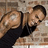 A pixelated image shows a person in a black sleeveless top lying on a patterned surface, next to bright pink text reading "The Way You Drop Drop Makes Me Wanna Pop!".