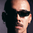 A 48x48 pixel buddy icon featuring a split composition with a grayscale portrait on the left and green text on a dark green background on the right, displayed as part of an animated contact sheet.