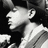 Black-and-white pixelated image of a person singing into a microphone with text overlays reading "Daddy Yankee" and "I Love You!"