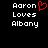 Pixelated text reads 'Aaron Loves Albany' with a red heart symbol replacing the 'o' in 'Aaron' on the left side of a black background.