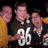 Three pixelated figures in sports jerseys with the number 86 on the front, standing side-by-side against a dark background.