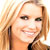 Static 50x50 pixel icon showing a close-up of a person with light brown hair and fair skin, smiling broadly against a white background.