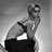Black-and-white pixelated image of a person in athletic pose with pink text "Girl On Fire" and "Edie Sedgwick" on black background.