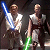 Two pixelated figures holding lightsabers against a dark background, one with blue and the other with green blades.