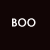 Pixelated white text 'BOO' on dark background next to a white ghost-shaped icon with two black eyes on black background.