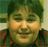 A 3x3 contact sheet of animated frames showing a person in a red and black checkered shirt with changing heart symbols above the name "Andy" or "Andy Milonakis".