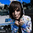 A pixelated image of a person with dark hair in a blue and white patterned hoodie against a blurred background, with cyan text on a pink background.