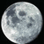 A pixelated moon image with text overlays on a split background of black, yellow, and gray sections.