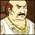 Pixelated cartoon character with bald head, red sideburns, mustache, and green necklace with yellow pendant against brown background.