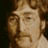 Four pixelated frames of a man's face in a 2x2 contact sheet with varying expressions and angles against dark background.
