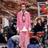 A pixelated image shows a person in pink attire standing among blurred figures, with 'SHAKAZULU' text and ':O' emoticon displayed.