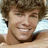 Pixelated image of a smiling person with light brown hair on the left, red text on a black background reading 'RYAN SHECKLER IS AWSOME CAN BUT ONLY WE DREAM! !!' on the right.