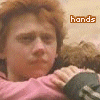 Four- shows characters in pink and dark clothing with text overlays; top-left reads 'hands', bottom-left labels one character 'Harry' while another displays 'off' on a sleeve