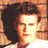 Static 48x48 pixel icon showing a close-up of a person's face with dark hair and light skin, rendered in warm orange-brown tones against a blurred background.