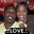 Two people in close proximity, one wearing a light-colored top with visible collar and shoulder straps, the other in darker clothing; text "LOVE" appears below them.