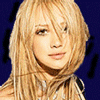 Pixelated image of a person with light brown hair against dark blue background, showing slight variation in lighting and text overlay.