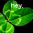 Animated green four-leaf clover with white text overlays on black background, transitioning between three distinct text states.