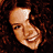 A 4-frame contact sheet of a woman with curly brown hair smiling in various poses, with "Coolbuddy.com" text on the right frame.