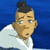 Pixelated cartoon character with topknot hair, light blue shirt, and worried expression against blue background; adjacent black-and-white emoticon symbol.