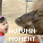 Pixelated image showing a person with dark hair and red clothing on the left, next to large brown animal-like shape, with white text reading 'AUTUMN MOMENT' overlaid.