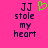 Pixelated text on bright pink background with green heart symbol above 'JJ stole my heart' text.