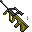 Pixelated green and black mechanical object with orange accents, shown in two states: one with a glowing white tip and scattered yellow fragments, the other without the glow or fragments.