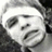 Pixelated grayscale image of a person with a headband, next to pixelated text reading "i can't believe you think i'm SEXXYY!".