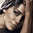 A 48x48 pixel animated contact sheet showing three sampled frames of a celebrity's face with varying expressions and poses, arranged in a 2x2 grid on a gray background.