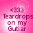 <333 Teardrops on my Guti ar text over pink gradient background with white light burst center.
