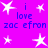 A static image with a bright purple background featuring white star shapes and blue text reading "i love zac efron" in two