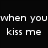 Black background with white text reading 'when you kiss me my heart turns to FIREWORKS' next to a pixelated figure in dark clothing holding an object near their face.