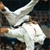 Static 50x50 pixel icon showing a white karate figure in mid-kick against dark background with visible dithering and anti-aliasing artifacts.