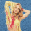 Pixelated image of a person with long blonde hair wearing red and black clothing, standing against blue background with text "britney spears" in white block letters.
