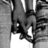 Black-and-white image of two hands clasped together with text overlays reading "the only reason god put spaces between my fingers is so ur hands could fill them up" and ">on+lex = <33".
