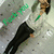 A person in a white top and black pants stands against a light background with green text, showing subtle pose changes across frames.
