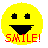 Yellow pixelated smiley face with black square eyes and a wide black mouth, red text reading 'SMILE!' below the mouth.