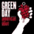 White hands hold red heart clusters against a black background with 'GREEN DAY' text in the top-left corner.