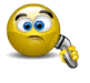 Yellow spherical avatar with blue eyes, black eyebrows, and a metallic robotic arm holding a yellow flower-like object.