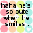 Pixelated text reads 'haha he's so cute when he smiles.' on a background of pastel-colored circles in pink, peach, yellow, and cyan.