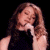 A 50x50 pixel animated buddy icon featuring a woman with long brown hair on the left and green text reading "Original Icons .com" on the right against a black background.