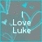 Pixelated icon with light blue text reading "I Love Luke" over a gray background featuring abstract teal and brown patterns.