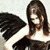 Pixelated static image of a person with long dark hair wearing white top and black wings against light background.