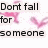 Animated pink hearts float around black text reading 'Don't fall for someone unless they are willing to catch you' on a white background.
