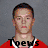 Six pixelated headshots in a , five of men in red jerseys with white trim and one Native American logo on white background