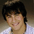 A pixelated image of a person with dark hair wearing a white checkered shirt, with orange text overlay reading "Ryne Sonborn= Love!! <3 <3" on the right side.