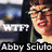 A pixelated image of a person with glasses and red lipstick, featuring text overlays including "WTF?" and partial names.