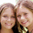 A 48x48 pixel buddy icon featuring two smiling young women with light brown hair on the left side and green text reading "Original Icons .com" on a dark green background on the right side.