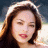 A pixelated image of a person with long brown hair and closed eyes, next to green text reading 'OriginalIcons.com' on a dark background.