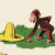 Animated contact sheet showing Curious George character in three sequential frames with yellow sombrero, green grass background, and red "Curious George" text at bottom.